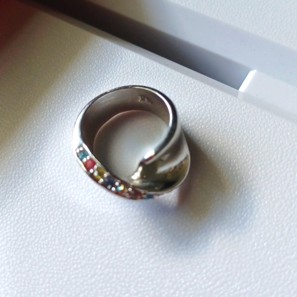Women's ring size 5 multi color stones can be pinky ring.